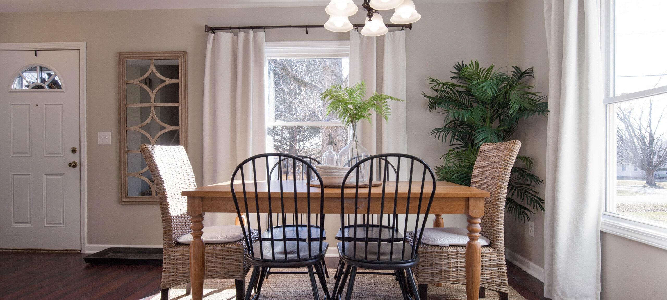 Beautiful staged dining room and chairs, typical of Cerro Gordo, IL