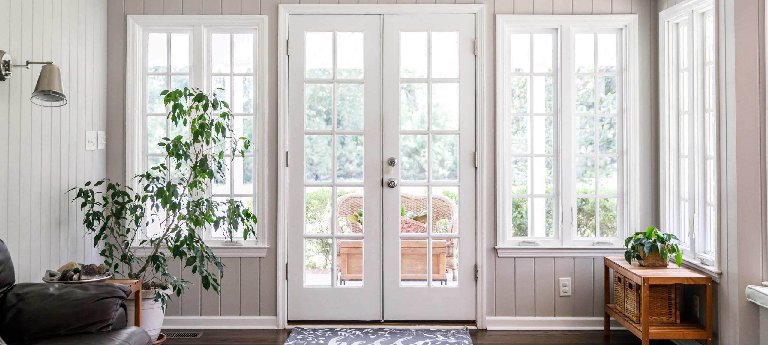 Sunroom and doors to back porch in home typical of East End Decatur